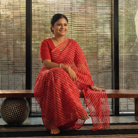 Red Leheriya Tie-Dye Kota Doria Cotton Saree, draped and worn by a woman, AI visual of the saree, iTokri