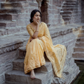 Orange Lucknow Chikankari Heavy Embroidery Chanderi Silk Saree, draped and worn by a woman, AI visual of the saree, iTokri