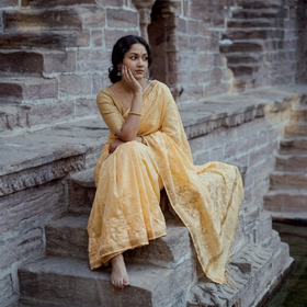 Orange Lucknow Chikankari Heavy Embroidery Chanderi Silk Saree, draped and worn by a woman, AI visual of the saree, iTokri