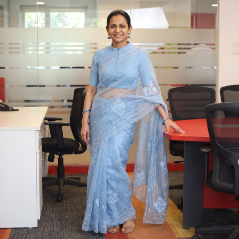 Blue Lucknowi Chikankari Heavy Bead Work Pure Organza Silk Saree, draped and worn by a woman, AI visual of the saree, iTokri