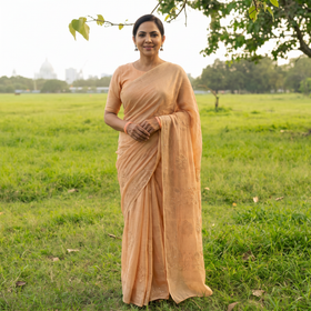 Beige Lucknowi Chikankari Heavy Mukaish Work Pure Mul Chanderi Saree, draped and worn by a woman, AI visual of the saree, iTokri
