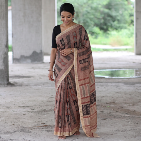 Beige Maheshwari Silk Bagh Hand Block Print Saree with Zari Border, draped and worn by a woman, AI visual of the saree, iTokri