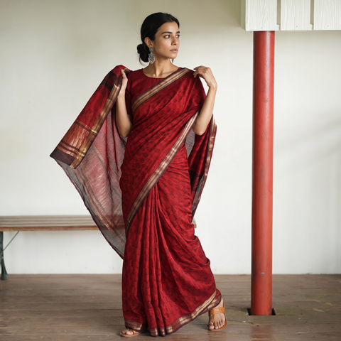 Red Maheshwari Silk Natural Dyed Bagh Hand Block Print Saree with Zari Border, draped and worn by a woman, AI visual of the saree, iTokri
