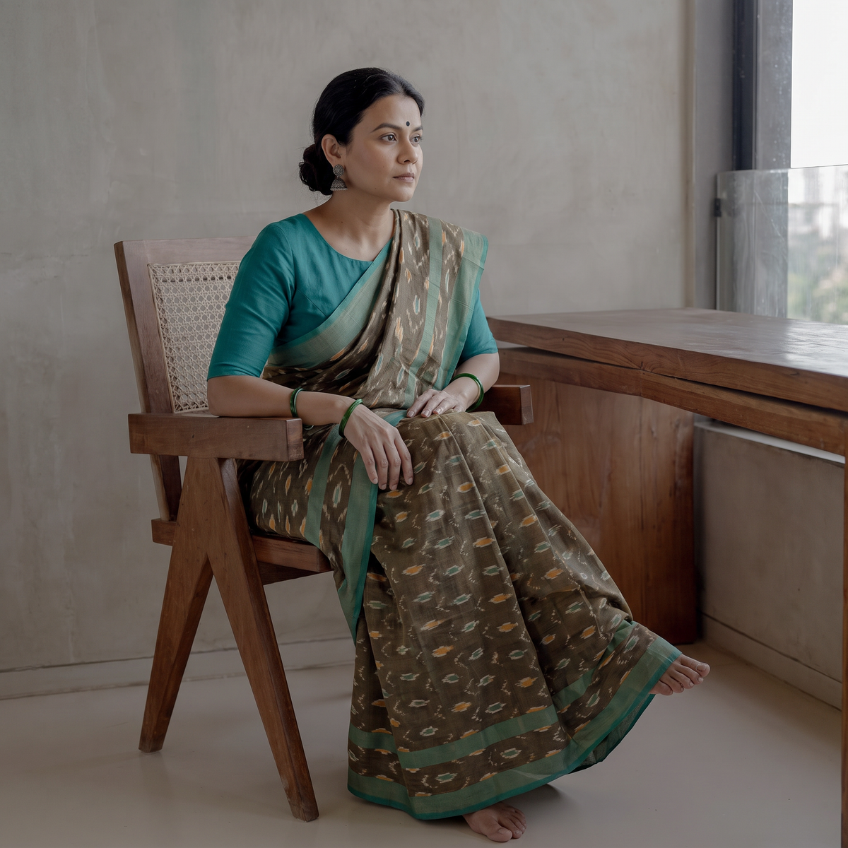 Green Mercerised Cotton Handloom Pochampally Ikat Saree, draped and worn by a woman, AI visual of the saree, iTokri