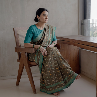Green Mercerised Cotton Handloom Pochampally Ikat Saree, draped and worn by a woman, AI visual of the saree, iTokri