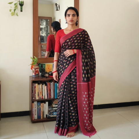 Black Mercerised Cotton Handloom Pochampally Ikat Saree, draped and worn by a woman, AI visual of the saree, iTokri