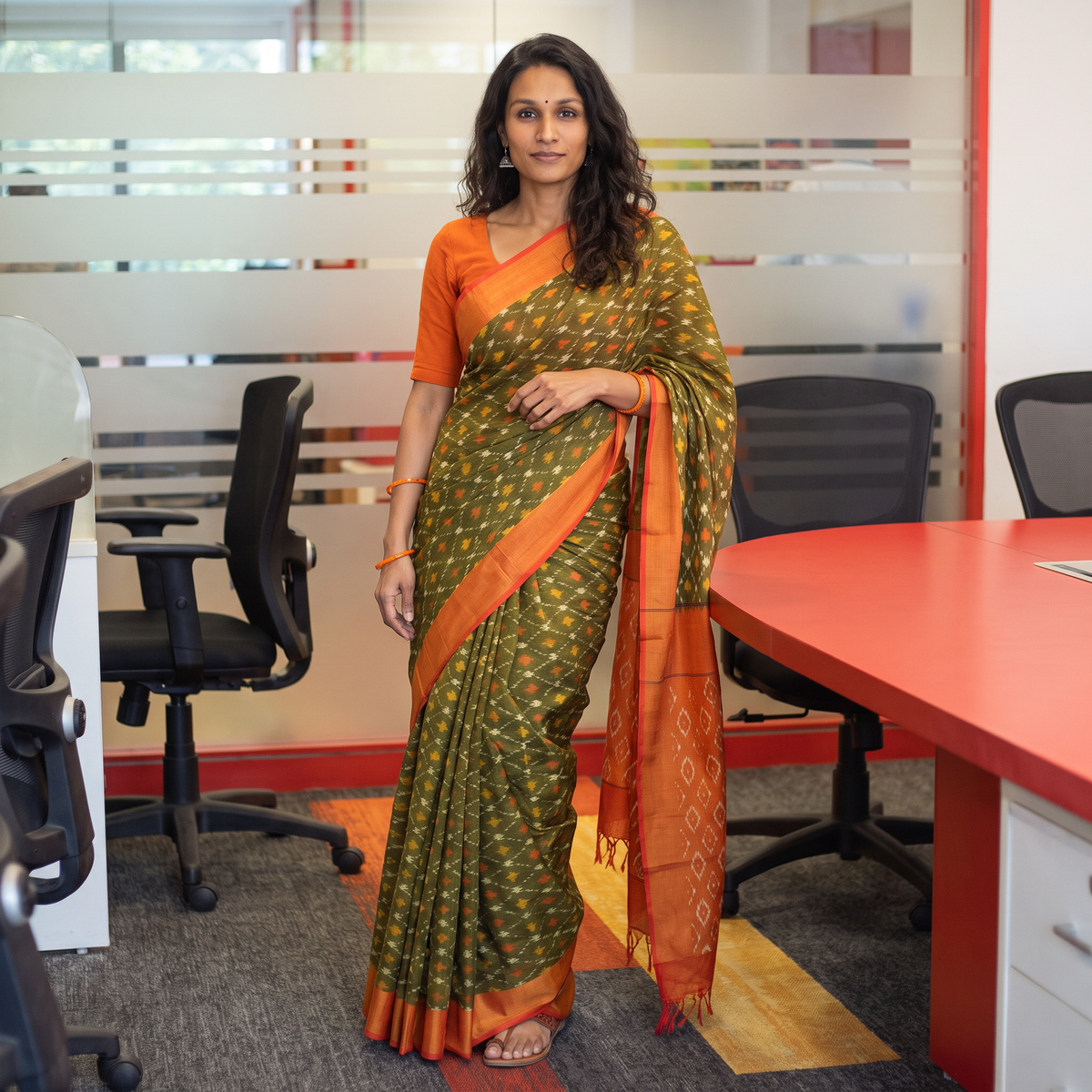 Green Mercerised Cotton Handloom Pochampally Ikat Saree, draped and worn by a woman, AI visual of the saree, iTokri