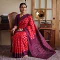 Red Mercerised Cotton Handloom Pochampally Ikat Saree, draped and worn by a woman, AI visual of the saree, iTokri