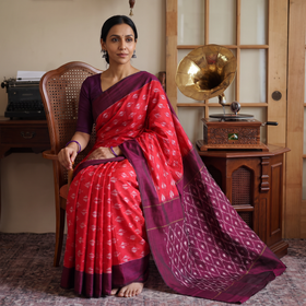 Red Mercerised Cotton Handloom Pochampally Ikat Saree, draped and worn by a woman, AI visual of the saree, iTokri