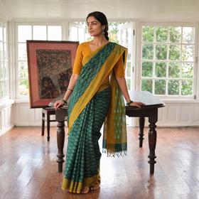 Green Mercerised Cotton Handloom Pochampally Ikat Saree, draped and worn by a woman, AI visual of the saree, iTokri