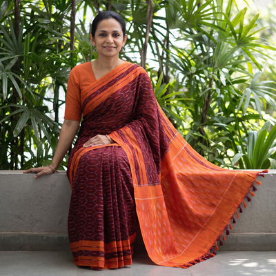 Maroon Mercerised Cotton Handloom Pochampally Ikat Saree, draped and worn by a woman, AI visual of the saree, iTokri