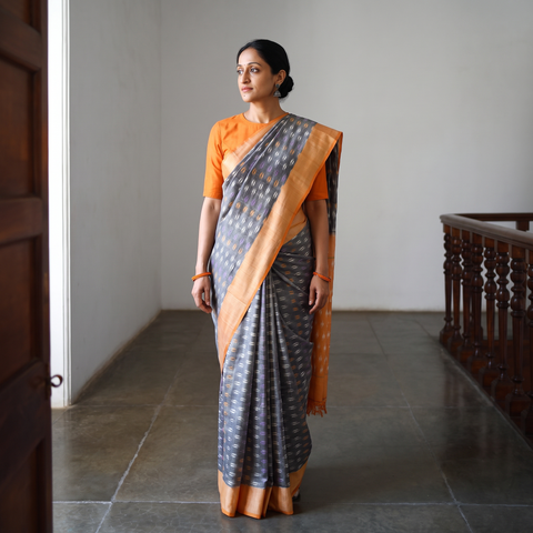 Grey Mercerised Cotton Handloom Pochampally Ikat Saree, draped and worn by a woman, AI visual of the saree, iTokri