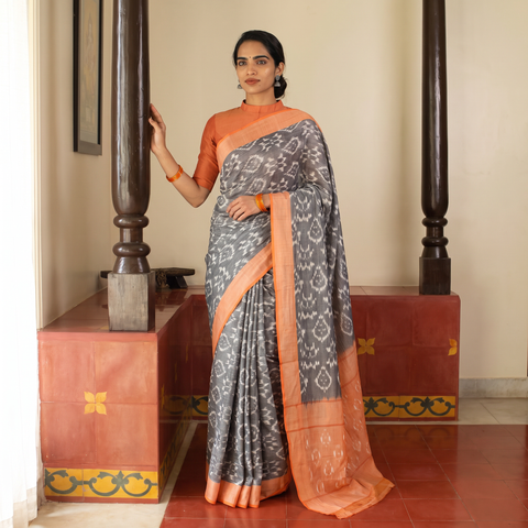 Grey Mercerised Cotton Handloom Pochampally Ikat Saree, draped and worn by a woman, AI visual of the saree, iTokri