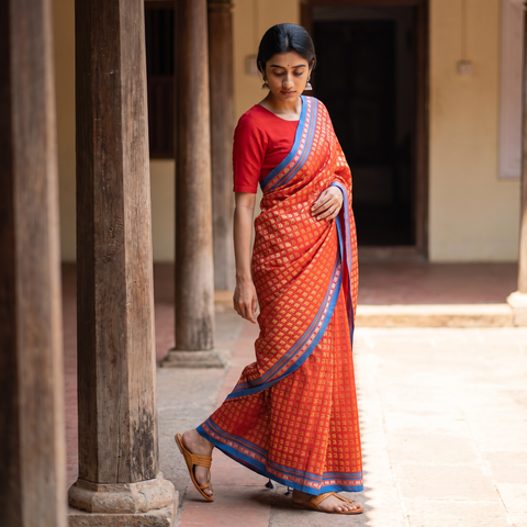 Orange Mercerised Cotton Silk Khun Saree with Blouse Piece, draped and worn by a woman, AI visual of the saree, iTokri