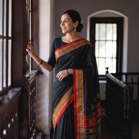 Black Mercerised Cotton Silk Plain Saree with Blouse Piece, draped and worn by a woman, AI visual of the saree, iTokri
