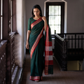 Green Mercerised Cotton Silk Plain Saree with Blouse Piece, draped and worn by a woman, AI visual of the saree, iTokri