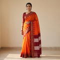 Orange Mercerized Cotton Ilkal Saree With Blouse, draped and worn by a woman, AI visual of the saree, iTokri