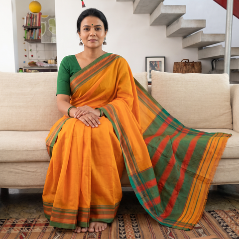 Orange Mercerized Cotton Saree with Border, draped and worn by a woman, AI visual of the saree, iTokri