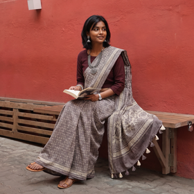 Grey Merino Wool Block Print Ajrakh Saree with Tassels, draped and worn by a woman, AI visual of the saree, iTokri