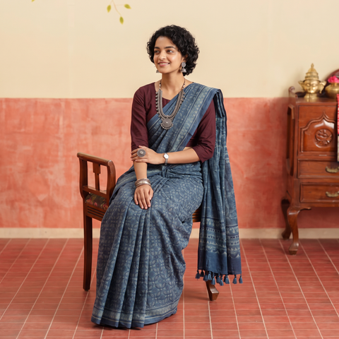 Blue Merino Wool Block Print Ajrakh Saree with Tassels, draped and worn by a woman, AI visual of the saree, iTokri