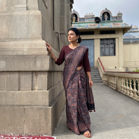 Brown Merino Wool Block Print Ajrakh Saree with Tassels, draped and worn by a woman, AI visual of the saree, iTokri