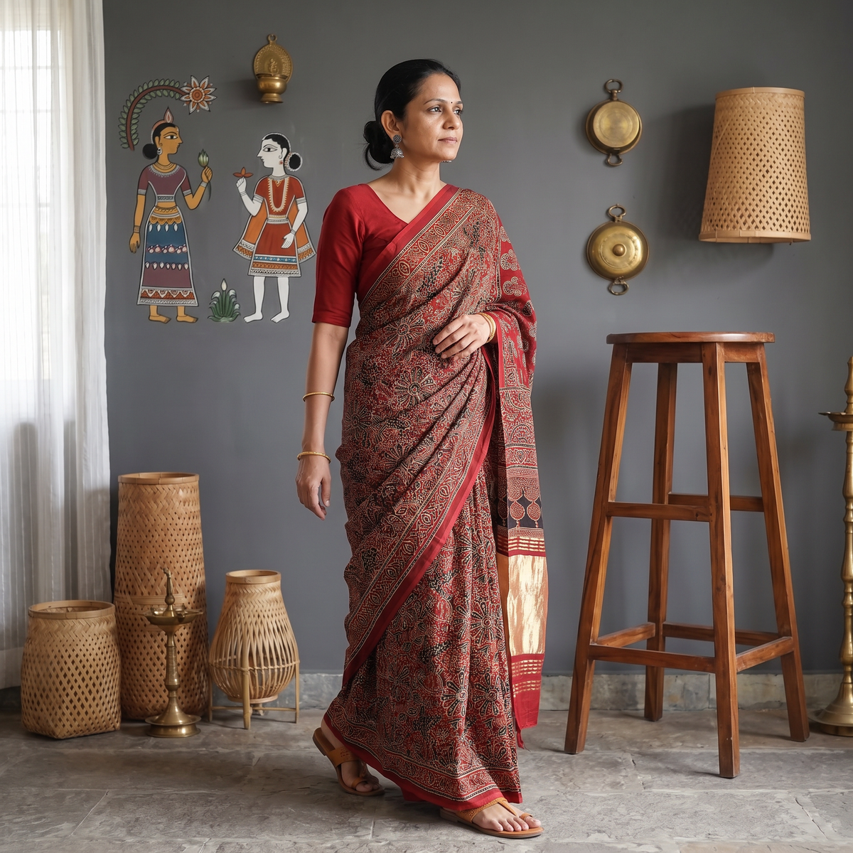 Red Modal Silk Block Printed Ajrakh Saree with Zari Border, draped and worn by a woman, AI visual of the saree, iTokri