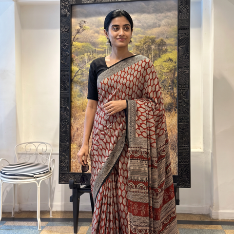 Red Modal Silk Hand Block Print Bagru Saree, draped and worn by a woman, AI visual of the saree, iTokri