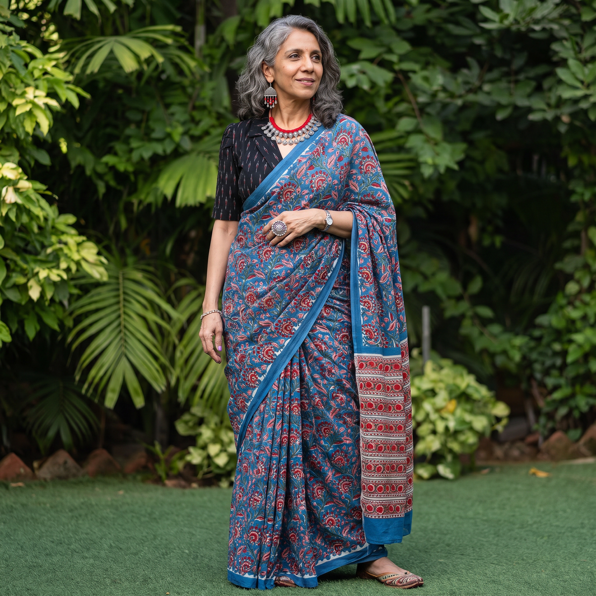 Blue Modal Silk Hand Block Sanganeri Print Saree, draped and worn by a woman, AI visual of the saree, iTokri