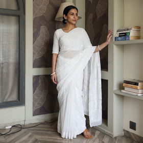 White Mukaish Hand Embroidered Georgette Heavy Beadwork Chikankari Lucknowi Saree, draped and worn by a woman, AI visual of the saree, iTokri