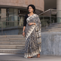 Beige Mul Cotton Block Print Ajrakh Saree, draped and worn by a woman, AI visual of the saree, iTokri