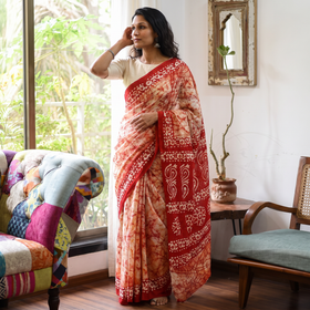Red Mul Cotton Hand Batik Print Saree, draped and worn by a woman, AI visual of the saree, iTokri