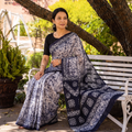 Blue Mul Cotton Hand Batik Print Saree, draped and worn by a woman, AI visual of the saree, iTokri