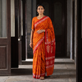 Orange Mul Cotton Hand Batik Print Saree, draped and worn by a woman, AI visual of the saree, iTokri