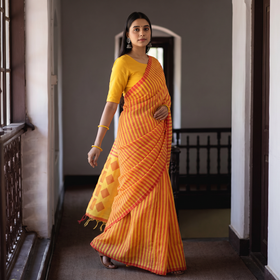 Multicolor Base Silk Cotton Saree with Red Buti on Pallu & Red Stripes on Body, draped and worn by a woman, AI visual of the saree, iTokri