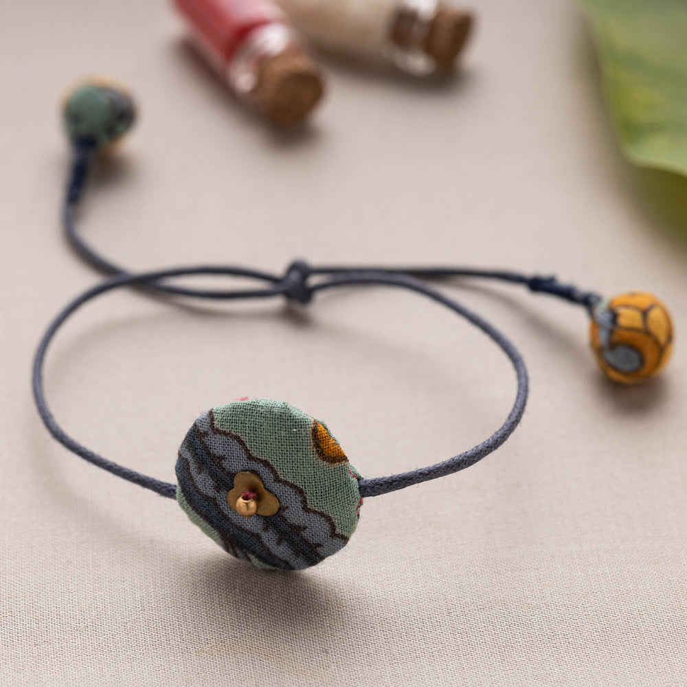 Buy Multicolor Fabric Artisanal Rakhi by Lukka Chuppi with Kumkum & Chawal Online at iTokri.com 