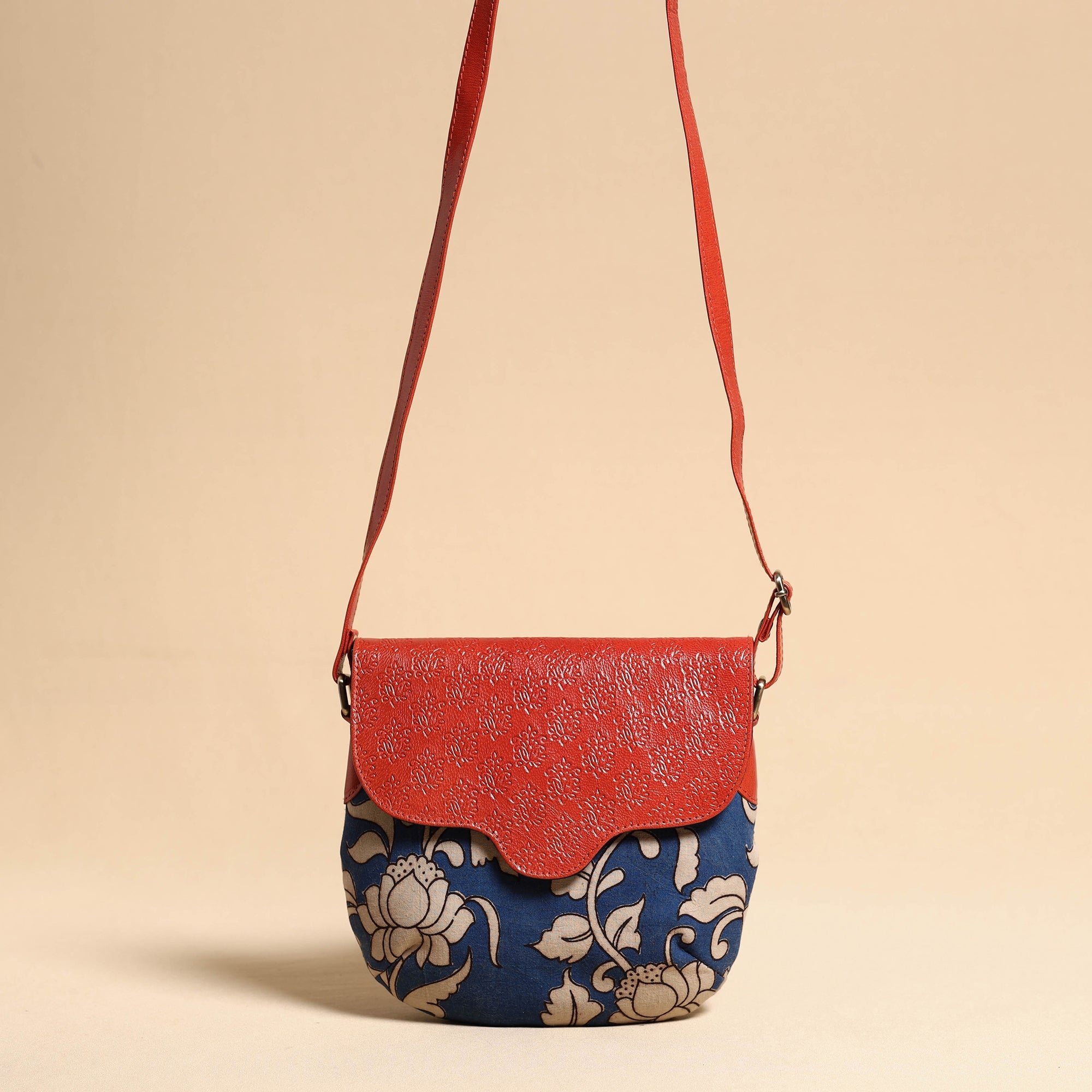  Handcrafted Kalamkari Printed Sling Bag with Embossed Leather Flap 