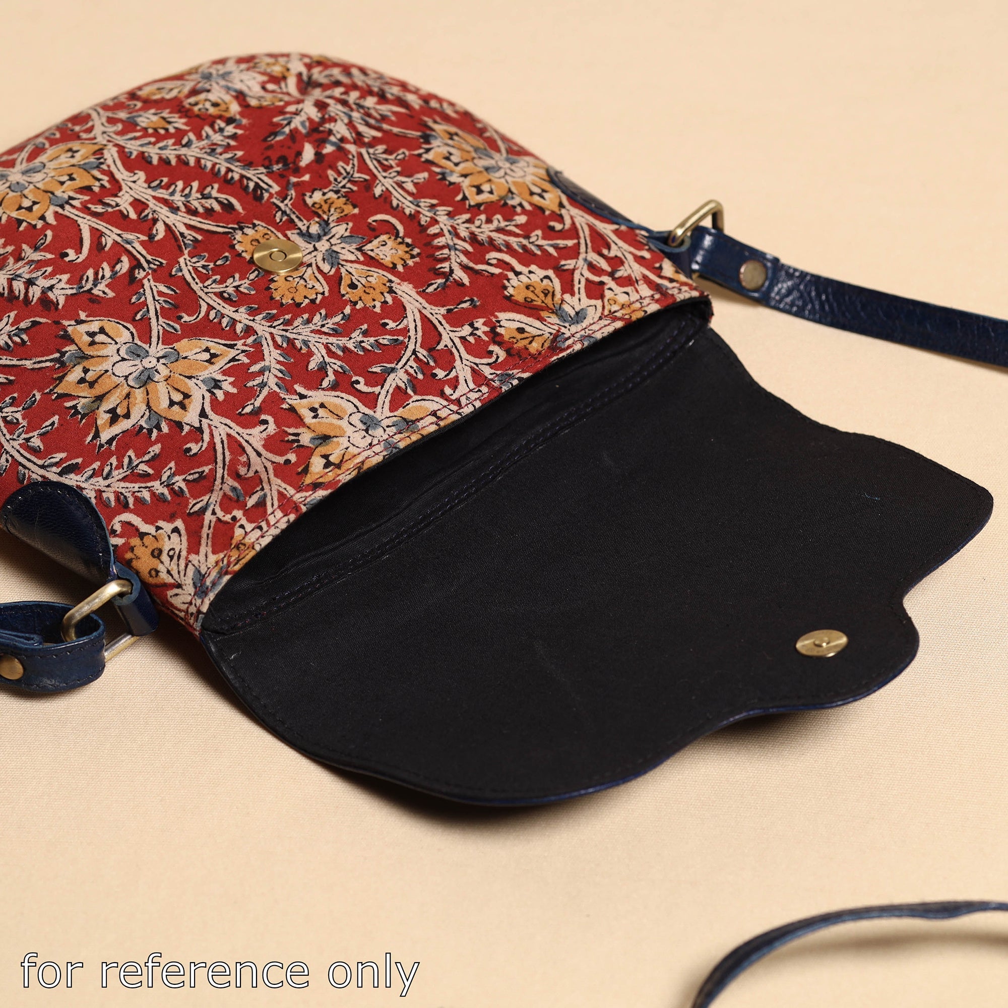  Handcrafted Kalamkari Printed Sling Bag with Embossed Leather Flap 