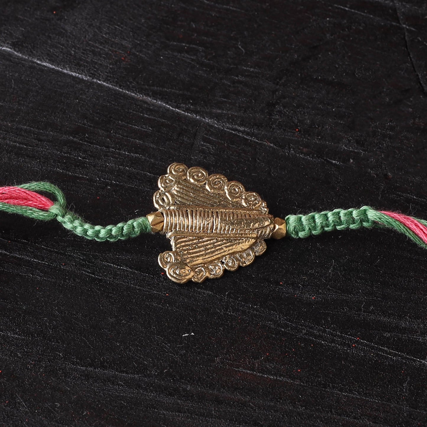 Handcrafted tribal dokra brass thread rakhi 01
