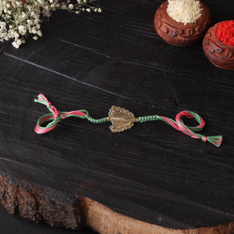 Handcrafted tribal dokra brass thread rakhi 01