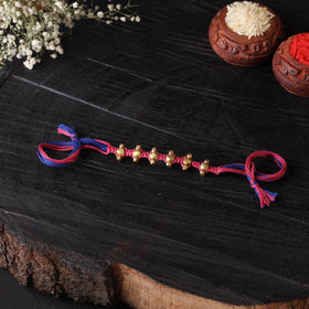 Handcrafted tribal dokra brass thread rakhi 14