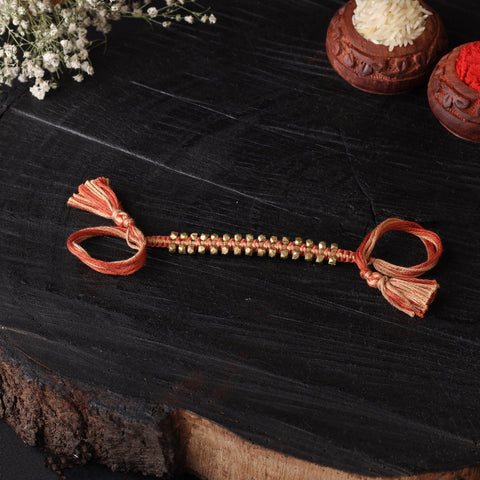 Handcrafted tribal dokra brass thread rakhi 15