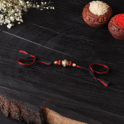 Handcrafted tribal dokra brass thread rakhi 19