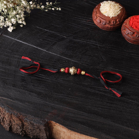 Handcrafted tribal dokra brass thread rakhi 19