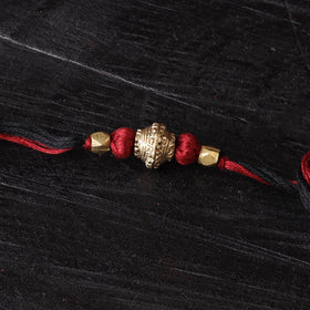 Handcrafted tribal dokra brass thread rakhi 19