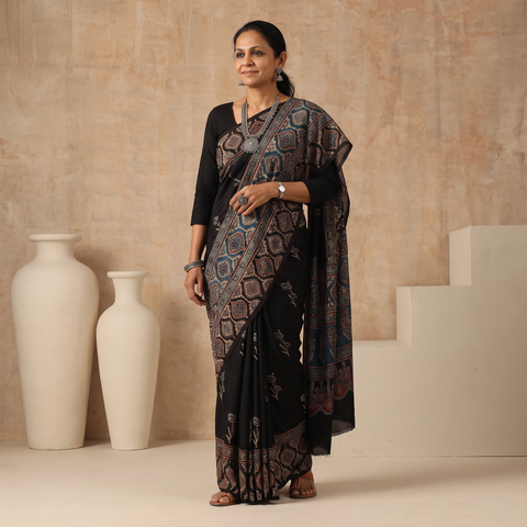 Black Natural Dyed Block Print Modal Silk Ajrakh Saree, draped and worn by a woman, AI visual of the saree, iTokri