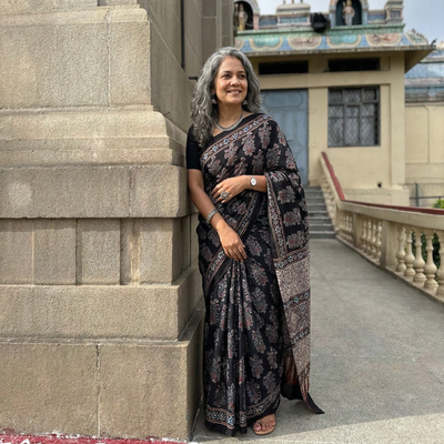 Black Natural Dyed Block Print Organza Silk Ajrakh Saree, draped and worn by a woman, AI visual of the saree, iTokri