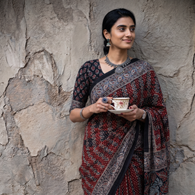 Red Natural Dyed Block Print Silk Ajrakh Saree, draped and worn by a woman, AI visual of the saree, iTokri