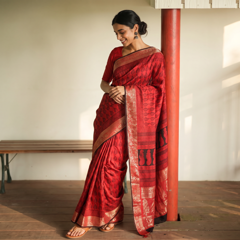 Red Natural Dyed Dola Silk Hand Block Print Saree with Zari Border, draped and worn by a woman, AI visual of the saree, iTokri