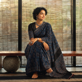 Blue Natural Dyed Hand Block Print Chanderi Silk Ajrakh Saree with Tassels, draped and worn by a woman, AI visual of the saree, iTokri