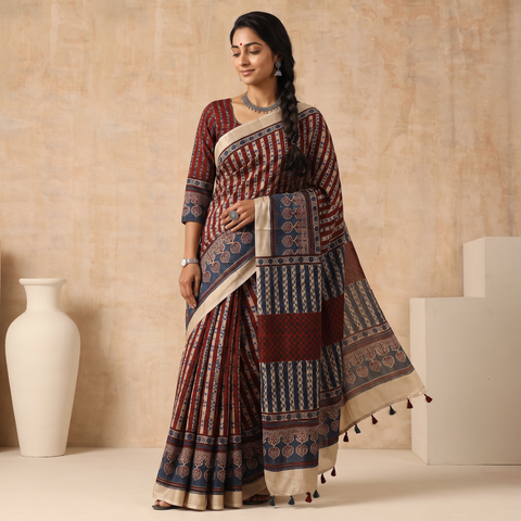 Multicolor Natural Dyed Hand Block Print Modal Silk Ajrakh Saree with Tassels, draped and worn by a woman, AI visual of the saree, iTokri